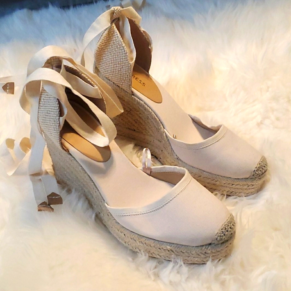 Lace up espadrille wedges.